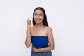 A young Filipino woman smiling while holding a whistle. Isolated on a white background