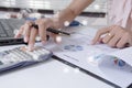 Young finance market analyst working at office on laptop while sitting at white table.Businessman analyze document Royalty Free Stock Photo