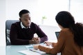 Financial Advisor Discussing Invoice With Her Client Royalty Free Stock Photo