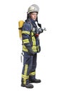 Young fireman with a mask and an air breathing apparatus on his back in a fully protective suit