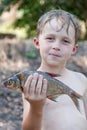 Young fisherman caught a bream