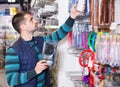 Young fisherman choosing fishing lures