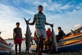 Young fisherman coming back from the sea