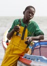 Young fisherman eating snack