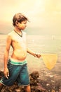 Young fisherman looks the horizon at sea