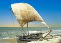 young fisherman sits in his old traditional sailor and waits for fishing