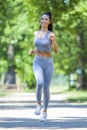 Young fit beautiful girl running outdoor Royalty Free Stock Photo