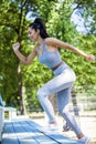 Young fit beautiful girl running outdoor up the stairs Royalty Free Stock Photo