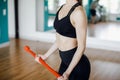 Young fit brunette girl doing exercise on the biceps with barbell. Crossfit, sports and health concepts Royalty Free Stock Photo