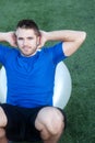 Young fit male athlete on workout ball Royalty Free Stock Photo