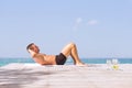 Young fit man doing abs crunches exercise outdoors Royalty Free Stock Photo