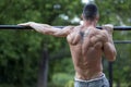 Young fit man doing exercises on the horizontal bar Royalty Free Stock Photo