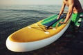 Young fit man on paddle board floating on lake. Royalty Free Stock Photo