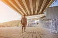 Young fit man running at outdoors, autumn , attractive dark skinned runner jogging fast, sport concept