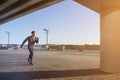 Young fit man running at outdoors, autumn , attractive dark skinned runner jogging fast, sport concept