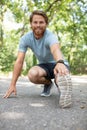 young fit man stretching legs outdoors Royalty Free Stock Photo