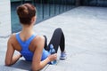 Young, fit and sporty woman resting after the training. Fitness, sport, urban jogging and healthy lifestyle concept. Royalty Free Stock Photo
