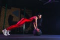 Young fit woman doing push up or plank exercise on medicine ball Royalty Free Stock Photo