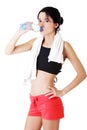 Young fit woman drinking mineral water Royalty Free Stock Photo