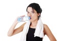 Young fit woman drinking mineral water Royalty Free Stock Photo