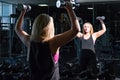 Young fit woman at the gym doing heavylifting exercise with bar Royalty Free Stock Photo