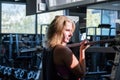 Young fit woman at the gym doing heavylifting exercise. Female a Royalty Free Stock Photo