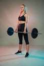 Fitness girl with barbell doing deadlift Royalty Free Stock Photo