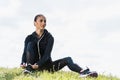 young fit woman lacing sneakers while sitting Royalty Free Stock Photo