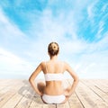 Young and fit woman meditating and stretching outdoors Royalty Free Stock Photo