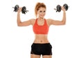 Young fit woman working out with dumbbells Royalty Free Stock Photo