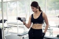 Young fitness asian woman exercise with machine Cable Crossover Royalty Free Stock Photo