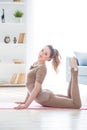 Young fitness beautiful woman female doing sport exercise deflection and yoga workout on mat in morning. Healthy lifestyle,