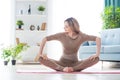 Young fitness beautiful woman female doing sport exercise, stretching and yoga workout on mat in morning. Healthy lifestyle, Royalty Free Stock Photo