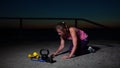 Young fitness female exercising outdoors