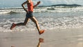 female runner running at beach Royalty Free Stock Photo