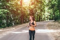 Young fitness girl running and listening music in the park Royalty Free Stock Photo