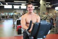 Young fitness guy working out on exercise bike Royalty Free Stock Photo