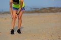 Fitness woman runner got sports injury on knee Royalty Free Stock Photo