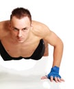 Young fitness man doing push ups on floor Royalty Free Stock Photo