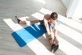 Young Fitness Man Stretches At The Floor Royalty Free Stock Photo