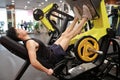 Asian chinese man in gym Ã¯Â¼ÅFitness sport man Training of leg strength in the gym Royalty Free Stock Photo