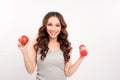 Young fitness model woman athlete in sportswear with red dumbbell and green apple. Healthy life bodybuilding lifestyle concept Royalty Free Stock Photo