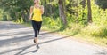 Young fitness sport woman running on the road in the morning, Young fitness sportswoman runner running on tropical park trail. Peo Royalty Free Stock Photo