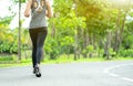 Young fitness sport woman running on the road in the morning, Young fitness sportswoman runner running on tropical park trail. Peo Royalty Free Stock Photo