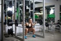 young fitness woman in bikini doing muscle building. Royalty Free Stock Photo