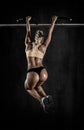 Young fitness woman chin-up on horizontal bar