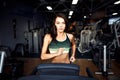 Young fitness woman doing cardio exercises at the gym running on a treadmill. Royalty Free Stock Photo