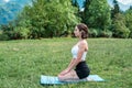 Young fitness woman doing morning yoga or pilates relax exercise mountains background Royalty Free Stock Photo