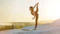 Young fitness woman doing yoga outdoors at sunset Royalty Free Stock Photo