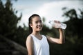 Young fitness woman hand holding water bottle after running Royalty Free Stock Photo